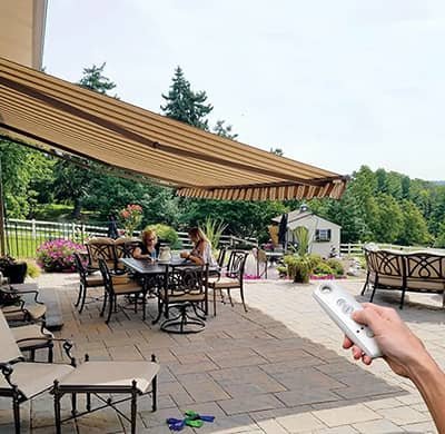 Retractable patio awning over outdoor dining