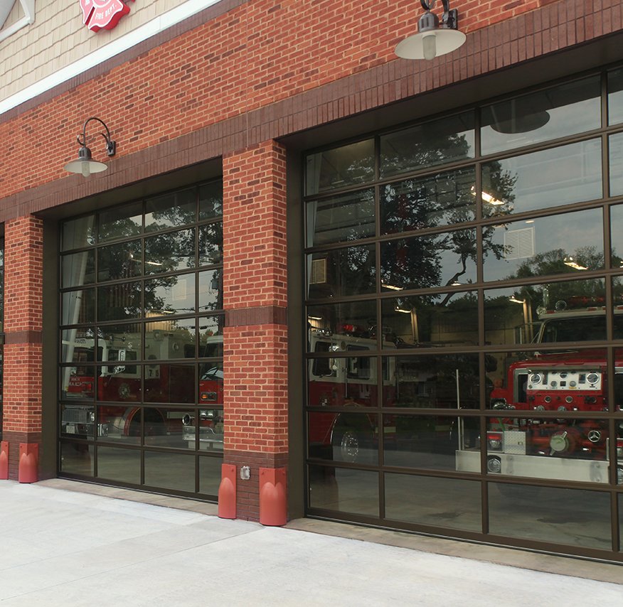 Full-view glass commercial doors at a fire station
